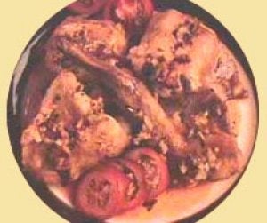 Conejo con tomate y vino blanco