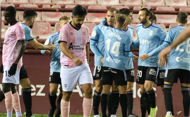The Cartagena players celebrate one of Ortuño's goals.