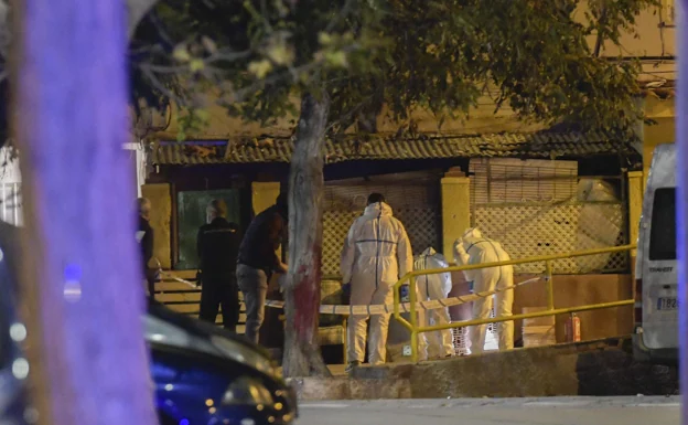 Specialists from the Judicial Police and the Scientific Police inspect the drug den where the shooting took place, on the night of November 6, in search of evidence. 