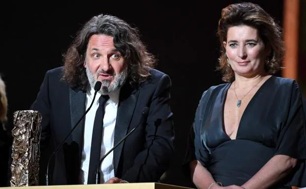 French film producer Olivier Delbosc and Sidonie Dumas receive the award for Best Film for 'The Lost Illusions'.