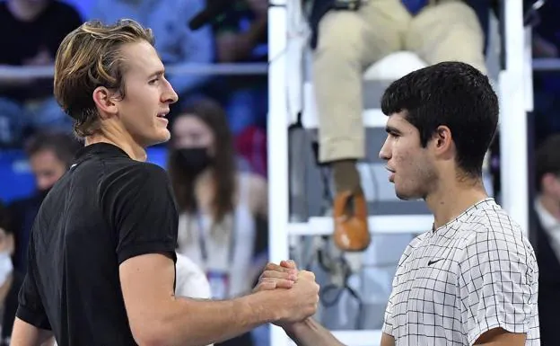 Sebastian Korda and Carlos Alcaraz greet each other after the final of the NextGen ATP Finals last year.