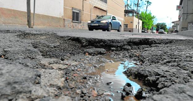 Destroyed road. Asphalt breakage on Juan XXIII street in the Murcian district of Cabezo de Torres 