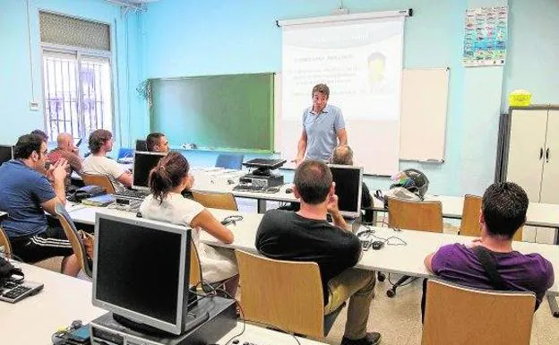 A teacher teaches a class in a classroom of an institute in the Region, in a file image.