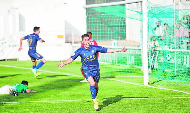 Castellón midfielder Liberto celebrates a UCAM goal. 