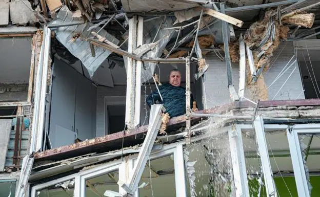 A man walks through the rubble of an apartment destroyed after a shelling in the Ukrainian city of Kherson.