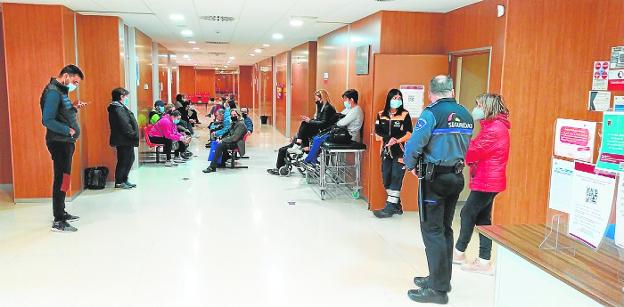 Users wait to be treated in the lobby of the Mula health center. 